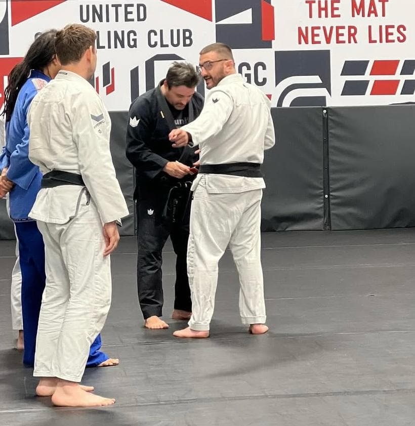 Gi students receiving technical instruction at United Grappling Club